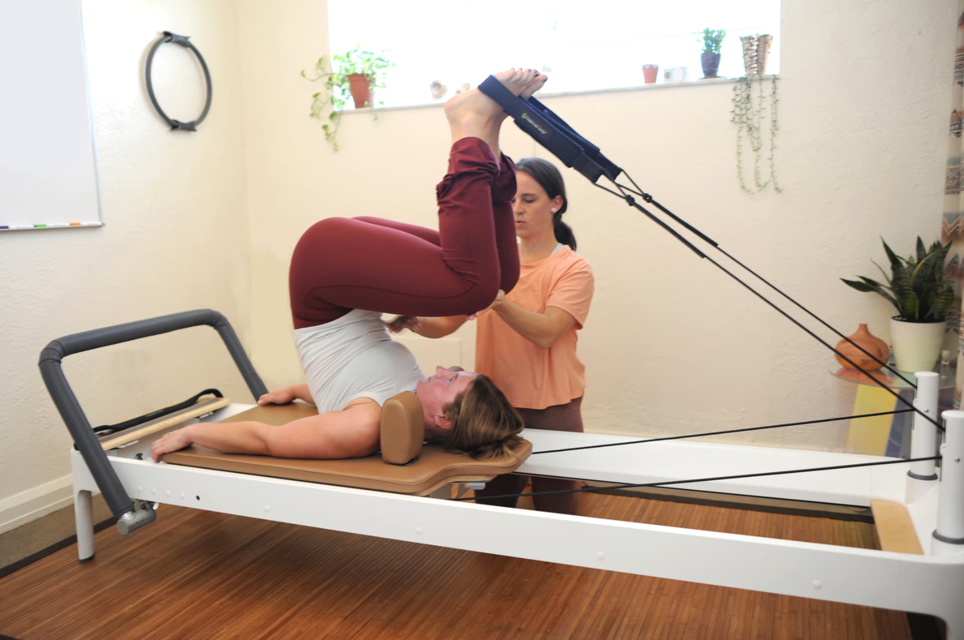 Client in a supported inversion with strap assistance
